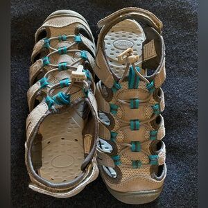 G. H. Bass women’s hiking/water sandals w/ bungee cinch straps & Velcro back.